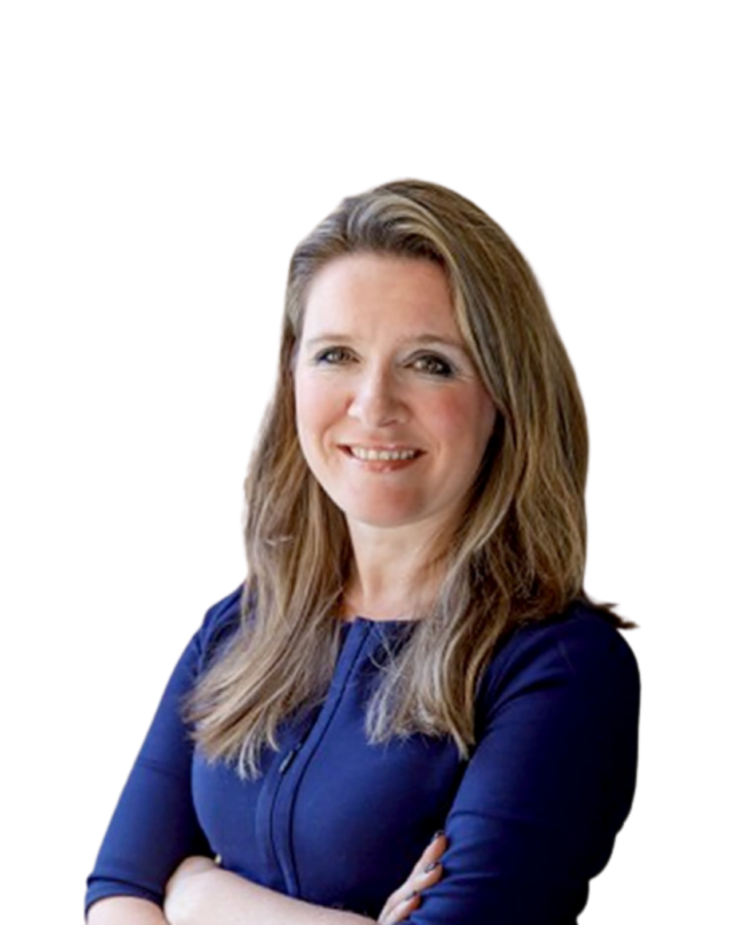 A woman with long, light brown hair wearing a navy blue top stands with arms crossed, smiling at the camera against a plain white background.